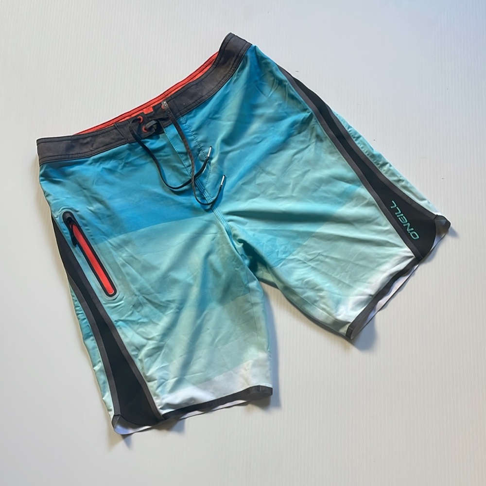O’Neill superfreak gray, orange, white & blue board shorts.  Men’s size 32